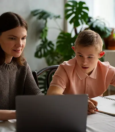 A special educator supporting a student during an online class